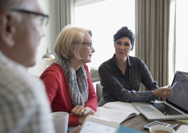 Senior Couple Meeting with Female Advisor